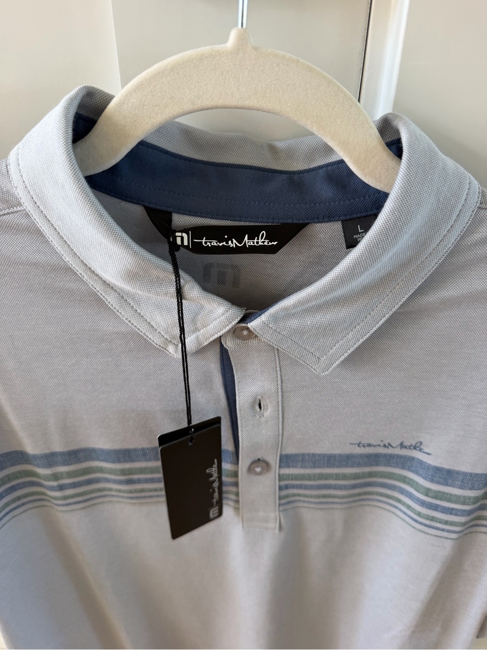 Travis Mathew Light Gray Polo with Blue and Green Stripe Accents